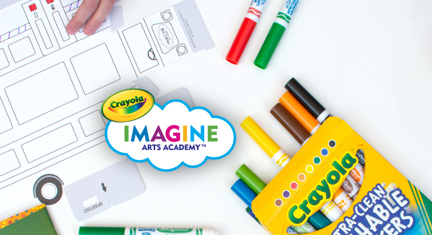 A kid coloring on a Crayola Imagine Arts academy take home train. In the middle of the train there is a Crayola Imagine arts 